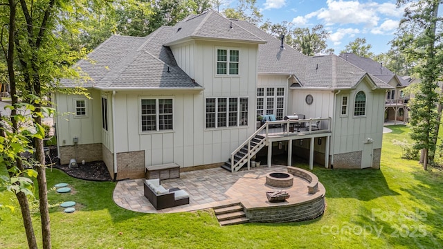 10874 Rise Ln, Fort Mill, SC 29707 - rear view of house with a fire pit, board and batten siding, and a patio
