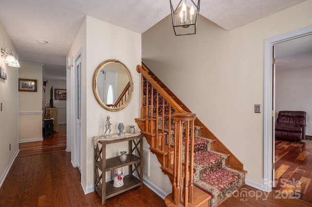 112 Ocean Dr, Shelby, NC 28152 - stairs with wood finished floors, a textured ceiling, and baseboards