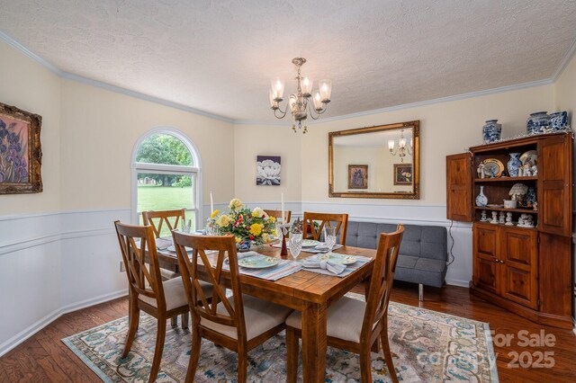 112 Ocean Dr, Shelby, NC 28152 - dining space featuring a chandelier, a textured ceiling, ornamental molding, wainscoting, and wood finished floors