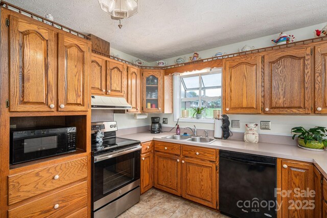112 Ocean Dr, Shelby, NC 28152 - kitchen with black appliances, under cabinet range hood, a textured ceiling, a sink, and brown cabinetry