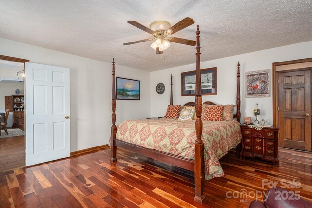 112 Ocean Dr, Shelby, NC 28152 - bedroom featuring wood finished floors, a textured ceiling, baseboards, and ceiling fan