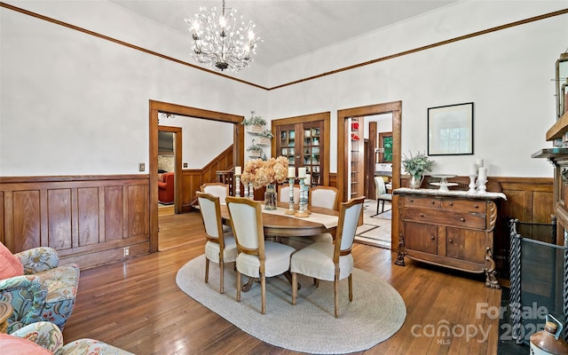 147 Preservation Way, Waynesville, NC 28786 - dining space with wainscoting, french doors, wood-type flooring, and a chandelier