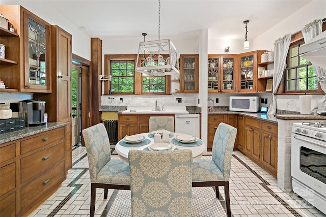 147 Preservation Way, Waynesville, NC 28786 - kitchen with white appliances, open shelves, brown cabinetry, and decorative backsplash