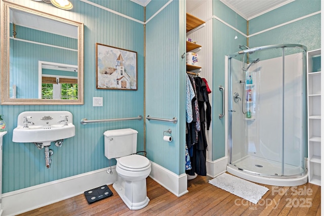 147 Preservation Way, Waynesville, NC 28786 - bathroom featuring wood finished floors, a shower stall, toilet, crown molding, and baseboards