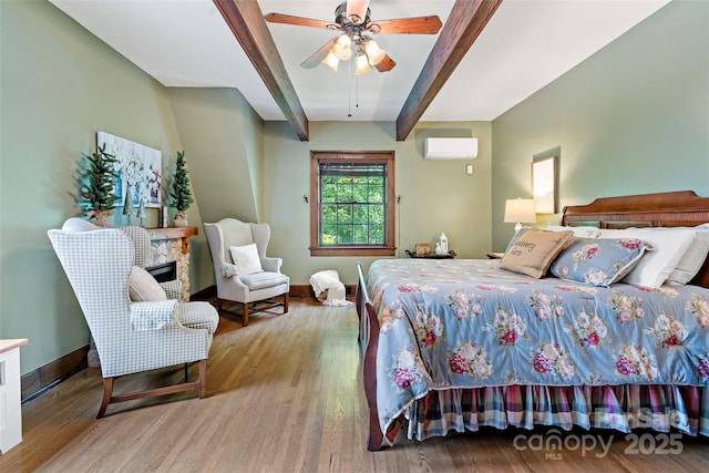 147 Preservation Way, Waynesville, NC 28786 - bedroom featuring beamed ceiling, a wall mounted air conditioner, wood finished floors, baseboards, and a ceiling fan