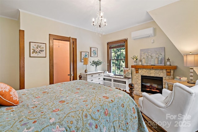 147 Preservation Way, Waynesville, NC 28786 - bedroom featuring a wall mounted AC, a fireplace, ornamental molding, and a chandelier