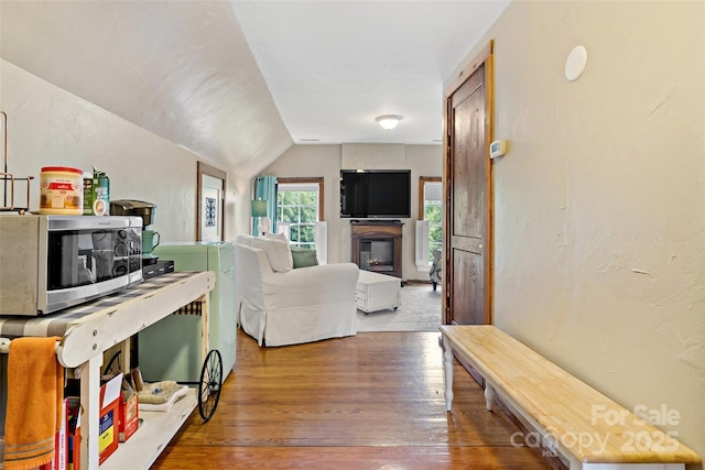 147 Preservation Way, Waynesville, NC 28786 - living room with hardwood / wood-style floors, lofted ceiling, and a glass covered fireplace