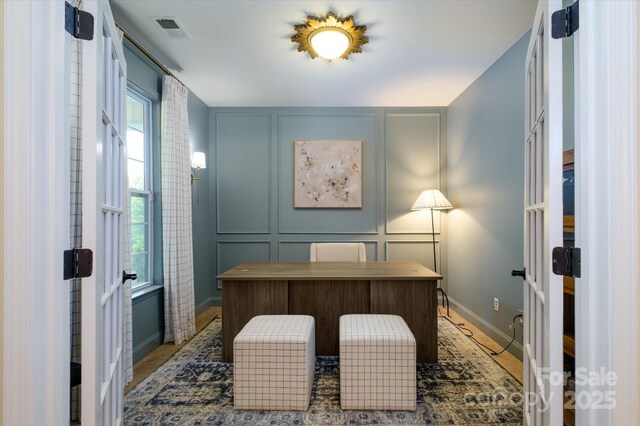 4323 Bright Rd, Charlotte, NC 28214 - office space featuring french doors, a decorative wall, plenty of natural light, and baseboards