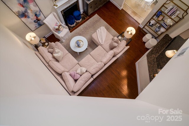 4323 Bright Rd, Charlotte, NC 28214 - living area featuring wood finished floors and a fireplace