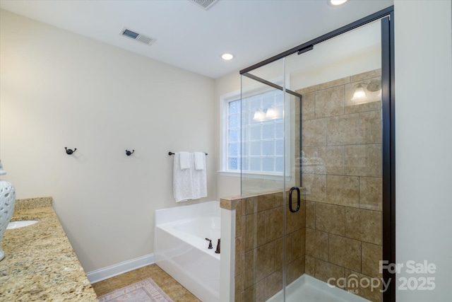 4323 Bright Rd, Charlotte, NC 28214 - bathroom featuring a bath, a stall shower, baseboards, vanity, and tile patterned floors