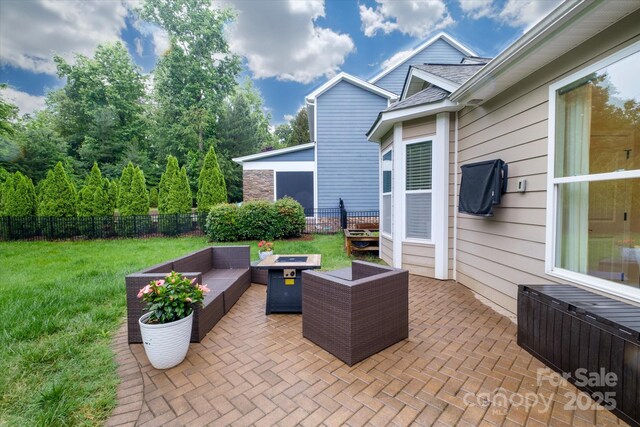 4323 Bright Rd, Charlotte, NC 28214 - view of patio featuring radiator heating unit and an outdoor living space with a fire pit