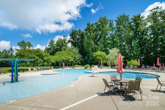 4323 Bright Rd, Charlotte, NC 28214 - community pool with a patio and view of scattered trees