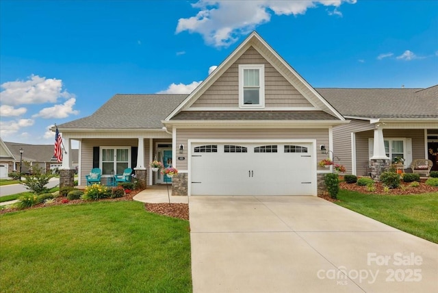 620 River Birch Dr, Salisbury, NC 28146 - craftsman-style house with covered porch, a front yard, concrete driveway, and stone siding
