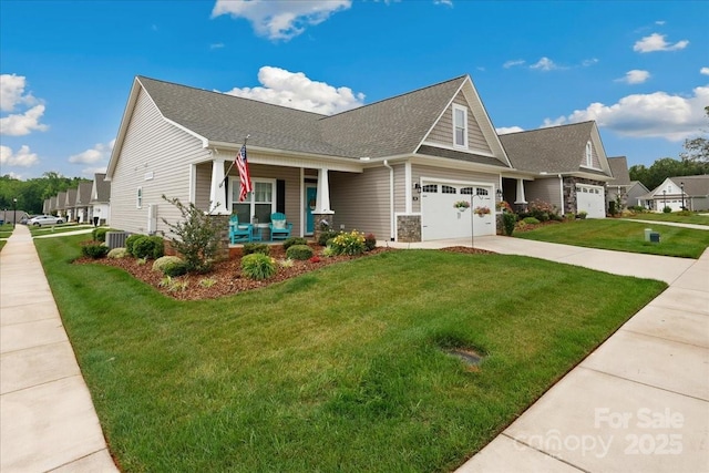 620 River Birch Dr, Salisbury, NC 28146 - craftsman-style house with a porch, a front lawn, driveway, central AC unit, and roof with shingles