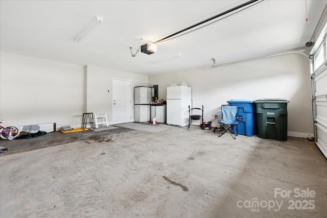 620 River Birch Dr, Salisbury, NC 28146 - garage featuring freestanding refrigerator and a garage door opener