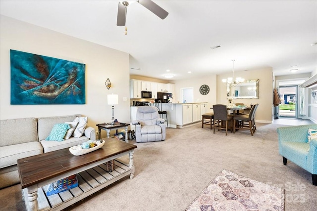 620 River Birch Dr, Salisbury, NC 28146 - living room featuring light carpet, a chandelier, ceiling fan, and baseboards