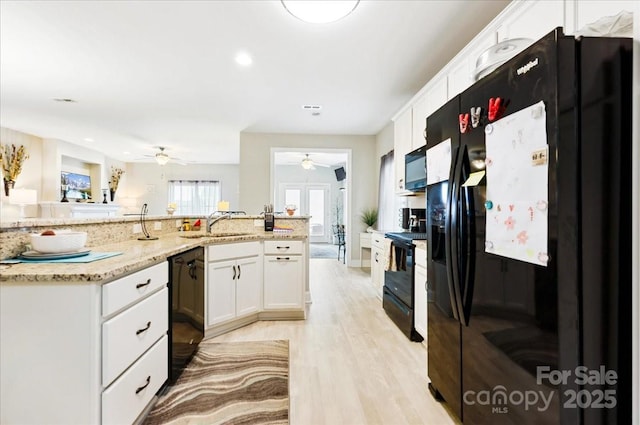 620 River Birch Dr, Salisbury, NC 28146 - kitchen with black appliances, a ceiling fan, white cabinetry, light wood finished floors, and recessed lighting