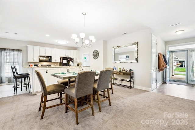 620 River Birch Dr, Salisbury, NC 28146 - dining room featuring a chandelier, light colored carpet, and baseboards
