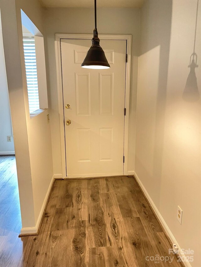 4317 Waxhaw Indian Trail Rd, Indian Trail, NC 28079 - doorway to outside featuring wood finished floors and baseboards