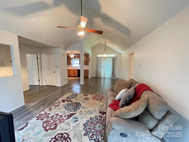 4317 Waxhaw Indian Trail Rd, Indian Trail, NC 28079 - living area featuring ceiling fan, vaulted ceiling, dark wood-style flooring, and baseboards