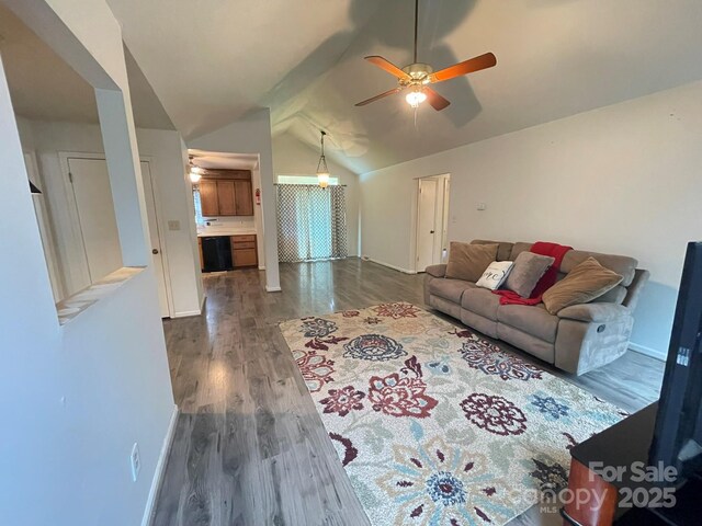 4317 Waxhaw Indian Trail Rd, Indian Trail, NC 28079 - living room with dark wood-type flooring, ceiling fan, vaulted ceiling, and baseboards
