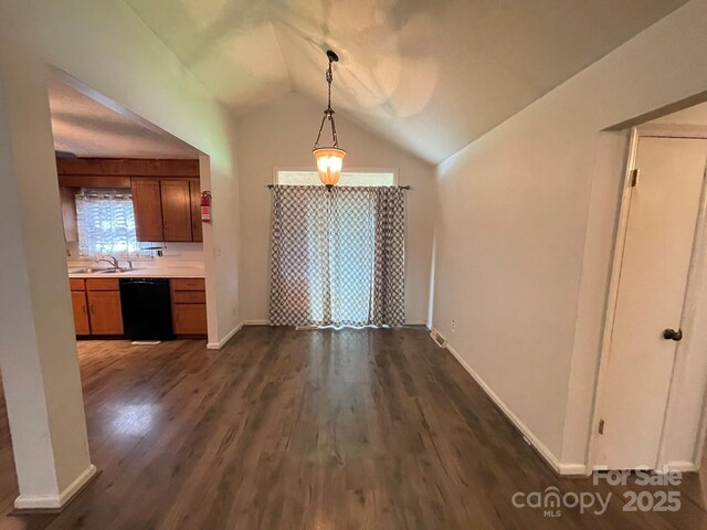 4317 Waxhaw Indian Trail Rd, Indian Trail, NC 28079 - unfurnished dining area with lofted ceiling, dark wood-style floors, a sink, and baseboards