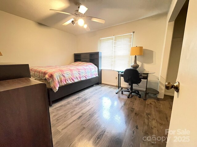 4317 Waxhaw Indian Trail Rd, Indian Trail, NC 28079 - bedroom with wood finished floors, baseboards, a desk, and a ceiling fan