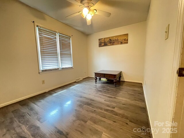 4317 Waxhaw Indian Trail Rd, Indian Trail, NC 28079 - spare room with wood finished floors, a ceiling fan, and baseboards