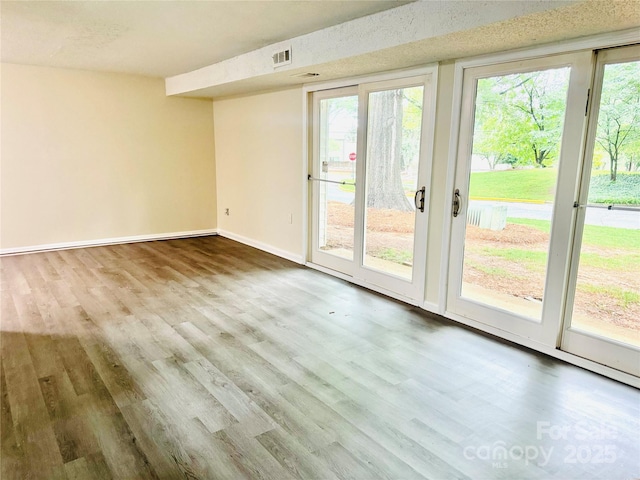 9541 Shannon Green Dr Unit C, Charlotte, NC 28213 - spare room with wood finished floors and baseboards