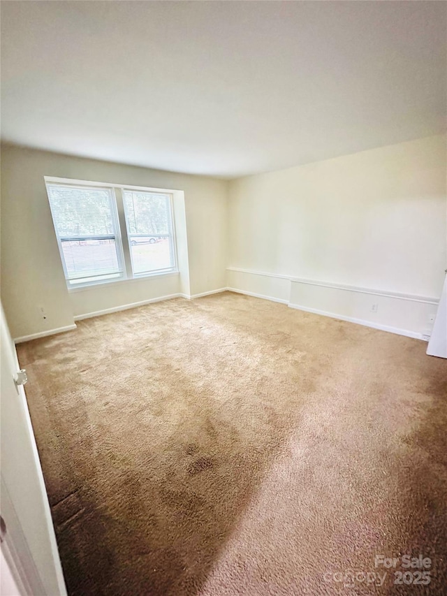 9541 Shannon Green Dr Unit C, Charlotte, NC 28213 - carpeted spare room featuring baseboards