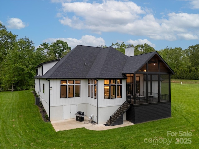38 Thistle Ln, Fletcher, NC 28732 - rear view of property with a sunroom, a patio, a chimney, stairs, and central AC unit