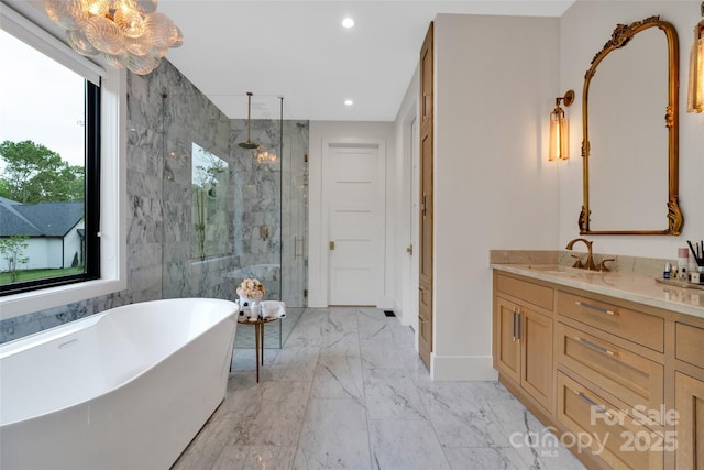 38 Thistle Ln, Fletcher, NC 28732 - bathroom featuring a marble finish shower, a freestanding bath, marble finish floors, vanity, and baseboards