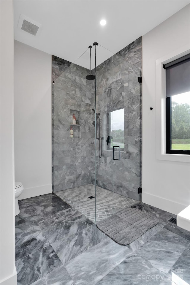 38 Thistle Ln, Fletcher, NC 28732 - bathroom with marble tiled flooring, a marble finish shower, toilet, baseboards, and recessed lighting