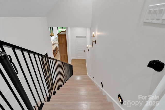 38 Thistle Ln, Fletcher, NC 28732 - staircase with wood finished floors, a wall mounted AC, and lofted ceiling
