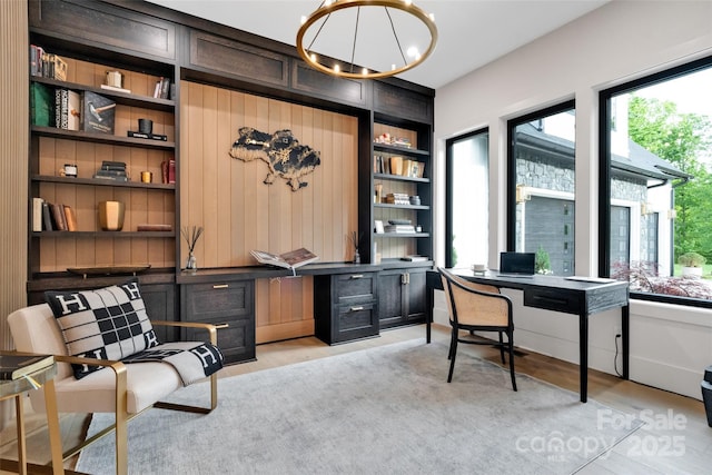 38 Thistle Ln, Fletcher, NC 28732 - office space with built in shelves, a chandelier, and light wood-style floors