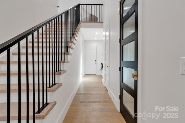 38 Thistle Ln, Fletcher, NC 28732 - hallway with hardwood / wood-style floors, baseboards, stairway, recessed lighting, and a towering ceiling