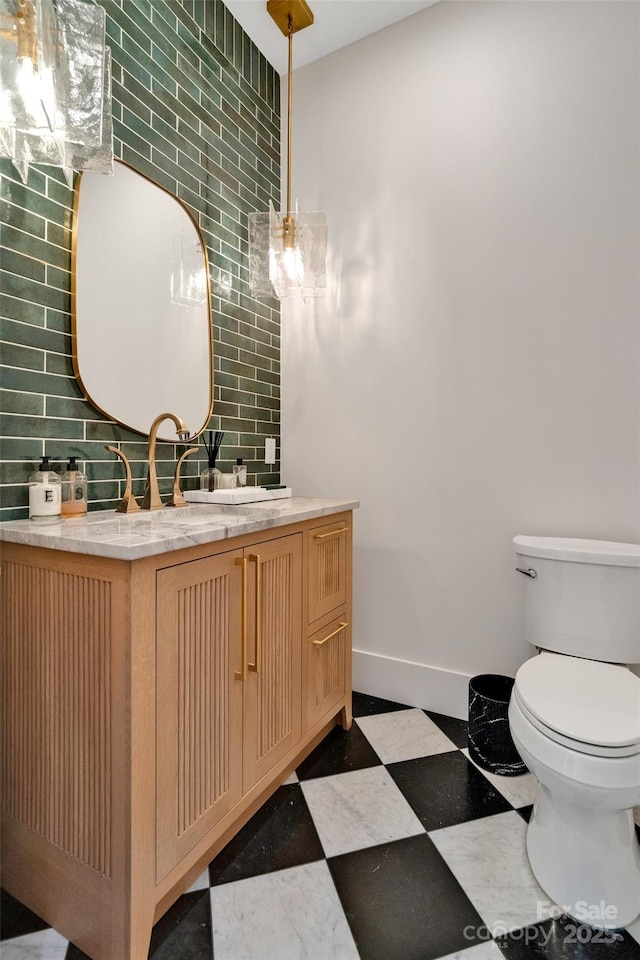38 Thistle Ln, Fletcher, NC 28732 - bathroom featuring toilet, vanity, baseboards, tile patterned floors, and backsplash
