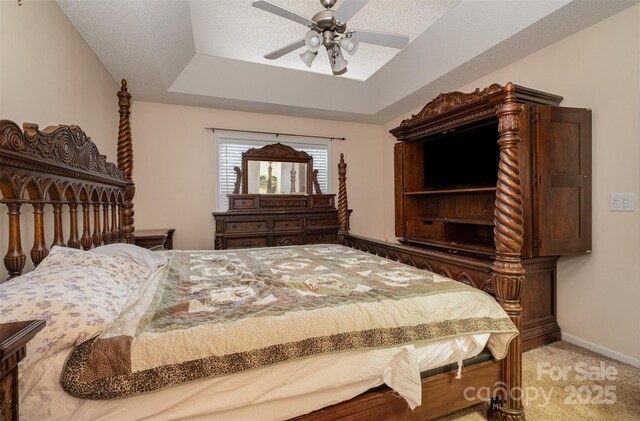 159 Pitts School Rd NW, Concord, NC 28027 - bedroom with a tray ceiling, carpet floors, a ceiling fan, and baseboards