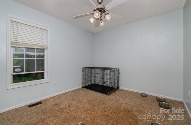 159 Pitts School Rd NW, Concord, NC 28027 - carpeted spare room with baseboards and a ceiling fan