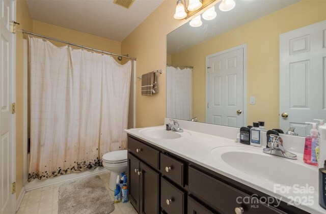 159 Pitts School Rd NW, Concord, NC 28027 - full bath featuring double vanity, toilet, and shower / bath combo