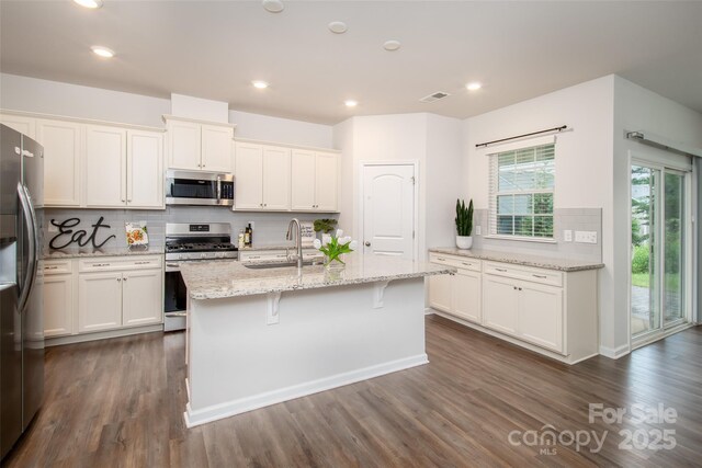 150 W Morehouse Ave, Mooresville, NC 28117 - kitchen featuring stainless steel appliances, a sink, dark wood-style floors, backsplash, and recessed lighting