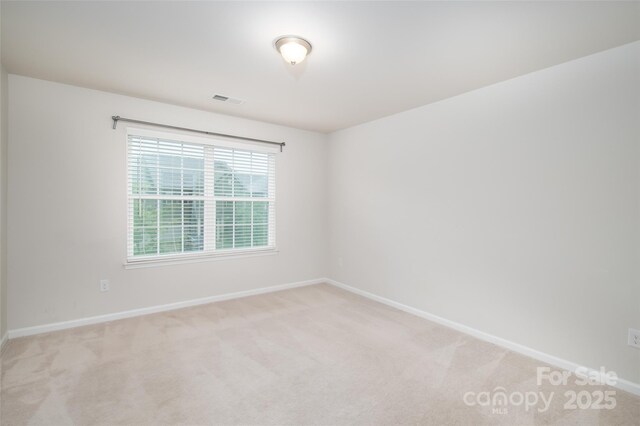 150 W Morehouse Ave, Mooresville, NC 28117 - unfurnished room with light carpet and baseboards