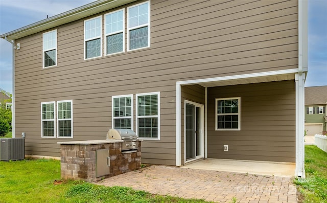 150 W Morehouse Ave, Mooresville, NC 28117 - back of property featuring an outdoor kitchen, central AC unit, and a patio