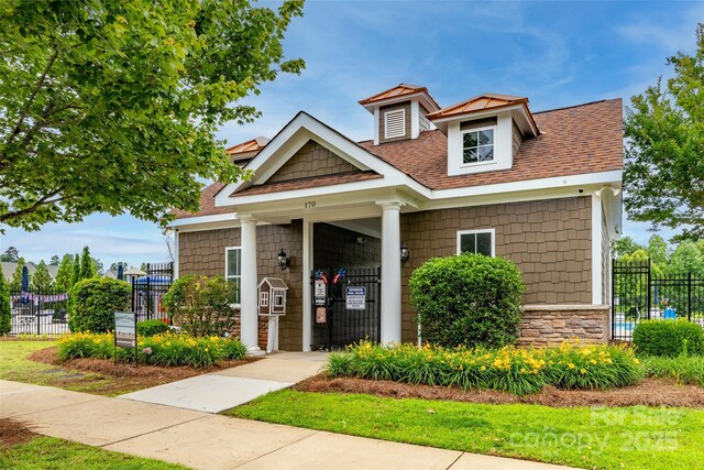 150 W Morehouse Ave, Mooresville, NC 28117 - view of front facade with roof with shingles and stone siding