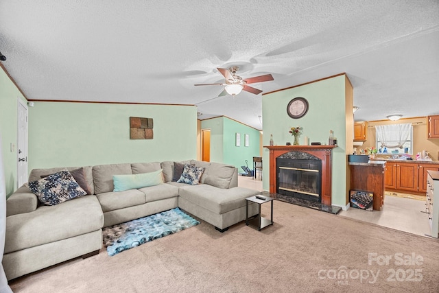 112 Cordella Rd, Candler, NC 28715 - living room featuring a textured ceiling, ceiling fan, a premium fireplace, and light colored carpet