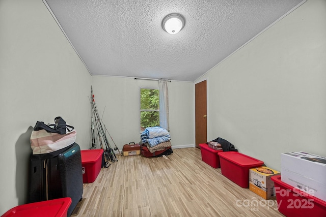 112 Cordella Rd, Candler, NC 28715 - playroom featuring a textured ceiling and wood finished floors