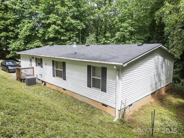 112 Cordella Rd, Candler, NC 28715 - back of house with crawl space, a lawn, central AC unit, and a shingled roof