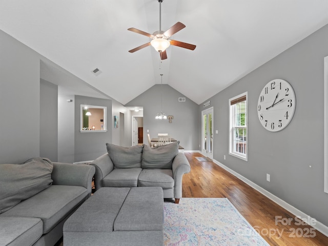 5369 Concord Rd, York, SC 29745 - living room featuring wood finished floors, a ceiling fan, a chandelier, vaulted ceiling, and baseboards