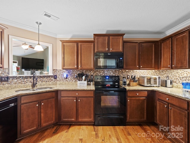5369 Concord Rd, York, SC 29745 - kitchen with black appliances, a sink, ornamental molding, light wood finished floors, and tasteful backsplash