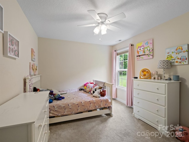 5369 Concord Rd, York, SC 29745 - bedroom with light carpet, a ceiling fan, and a textured ceiling